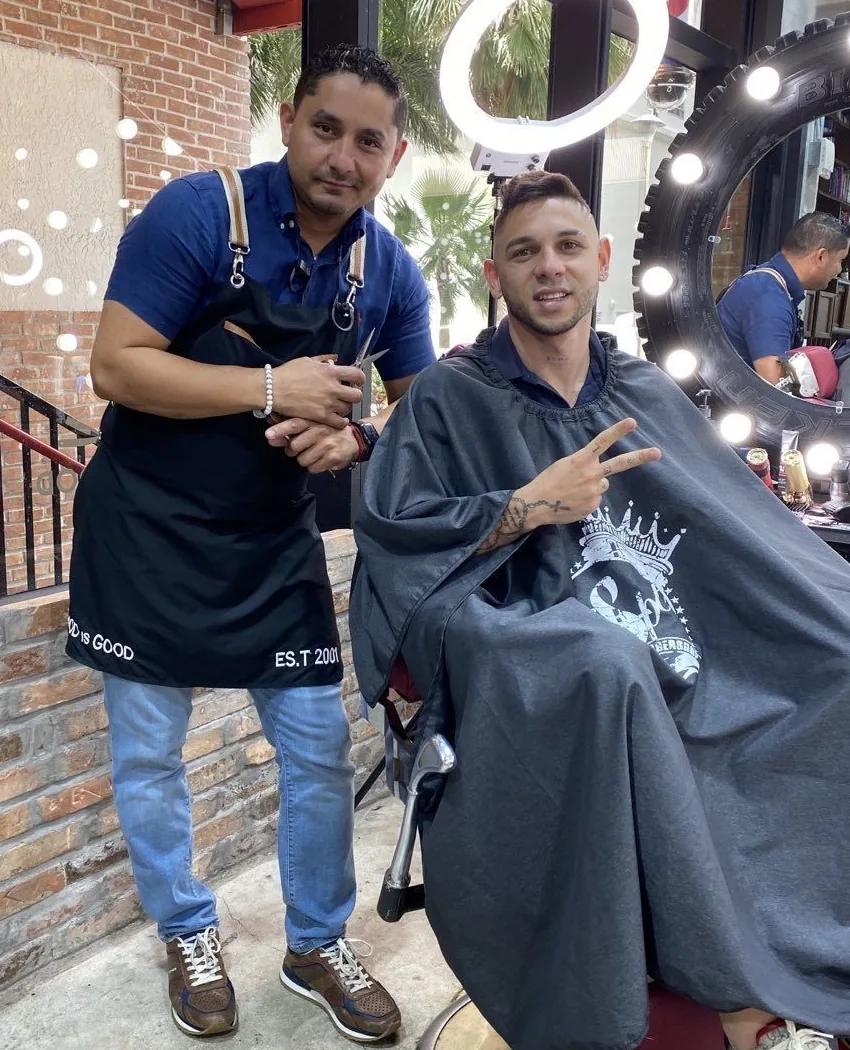 Aldo beside a client after a cut and beard trim at his Brickell barbershop