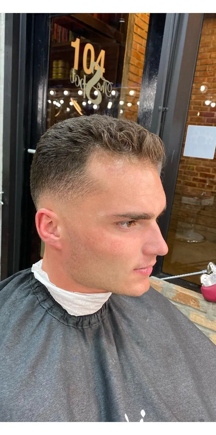 Skin fade cut by Aldo, shown from the side, blended from the skin up through the top