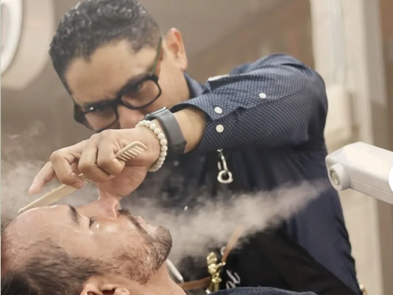 Hot towel and straight razor work during a Royal Shave