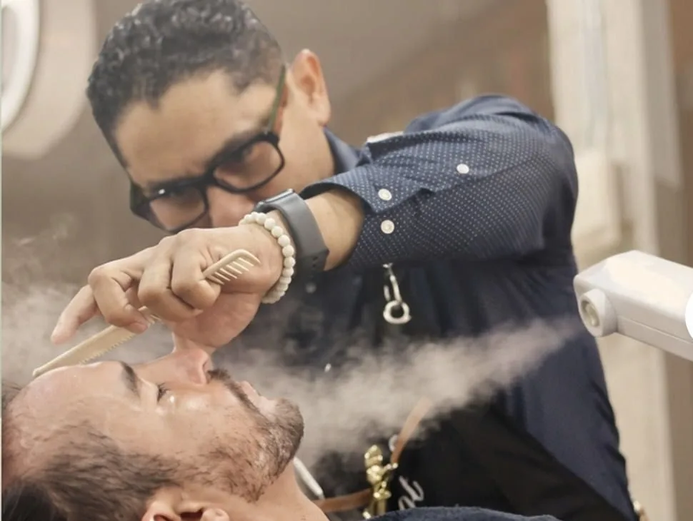 Hot towel and straight razor shave in progress at Aldostylist Barbershop