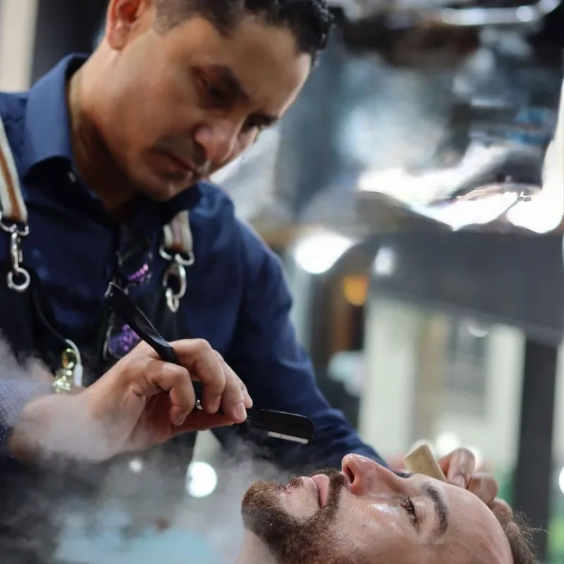 Straight razor detail work through a client's beard line
